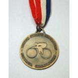 A yellow-metal British National Championship gold medal the obverse inscribed British Cycling