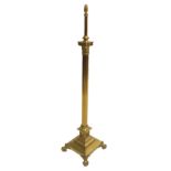 A brass telescopic standard lamp the Corinthian column on a high stepped square base on claw and