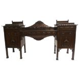 A Chinese Chippendale style mahogany pedestal sideboard the pagoda shaped pedestals with hinged