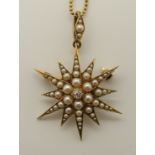 A 15ct gold diamond and pearl star pendant brooch length from bail 4.3cm, width 2.8cm, with a yellow
