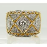 A bright yellow diamond set wide dress ring set with three estimated approx 0.15ct diamonds and