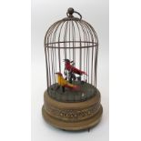 An early 20th century automaton musical box depicting two birds in a bird cage, 27cm high