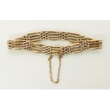 A 15ct gold gate bracelet with beaded bar design, length 18cm, weight 17.1gms