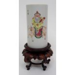 A Chinese spill vase painted with a figure seated on an ox, flanked by ten rows of calligraphy,