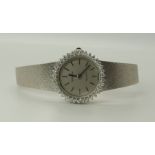 An 18ct white gold ladies diamond set Zenith Quartz watch with silver coloured dial baton numerals