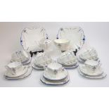 A Shelley Blue Iris pattern tea set in the Queen Anne shape comprising two cake plates, eleven cups,