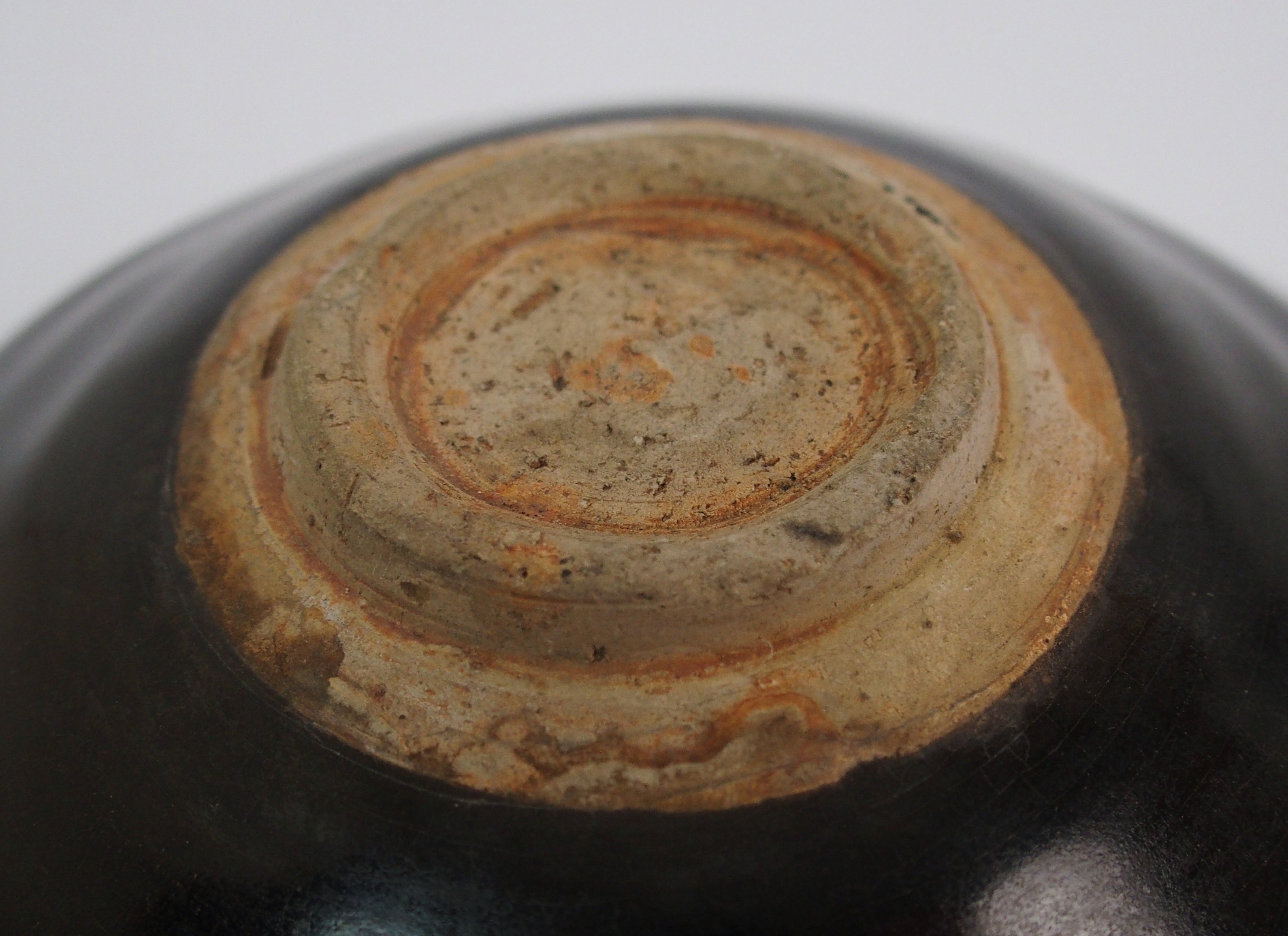 A Chinese black glazed bowl with single leaf decoration, 15.5cm diameter - Image 8 of 10