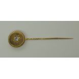 A large yellow metal stick pin set with an old cut diamond old cut diamond estimated approx 0.