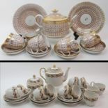 A Newhall porcelain part teaset the white ground with intertwined orange hoops with gilt and black