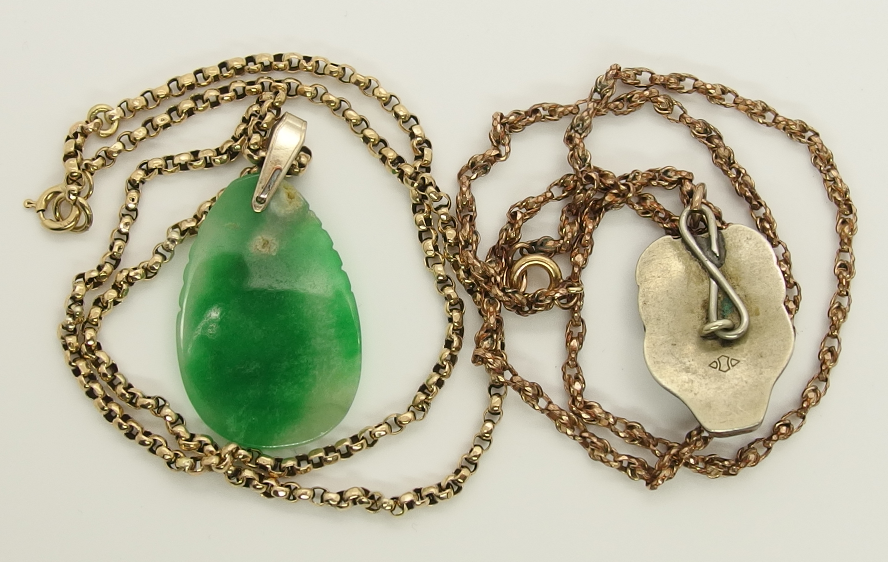A Chinese green hardstone pendant and a Japanese demon mask pendant the hardstone pendant is - Image 3 of 7