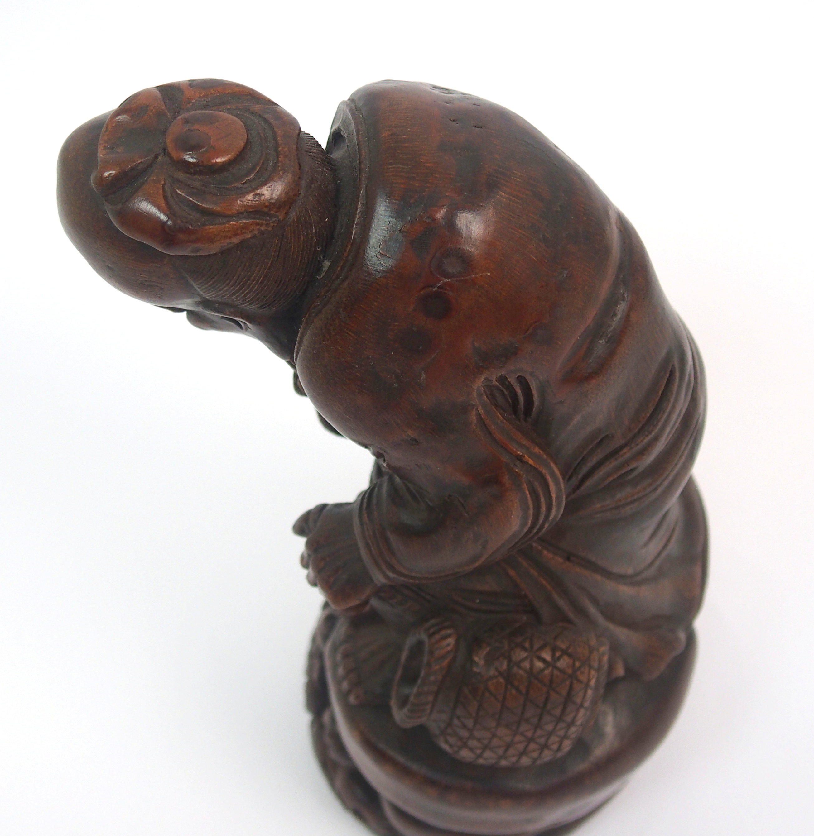 A Chinese bamboo figure of a fisherman seated on a rock above a young boy holding a fish amongst - Image 8 of 10