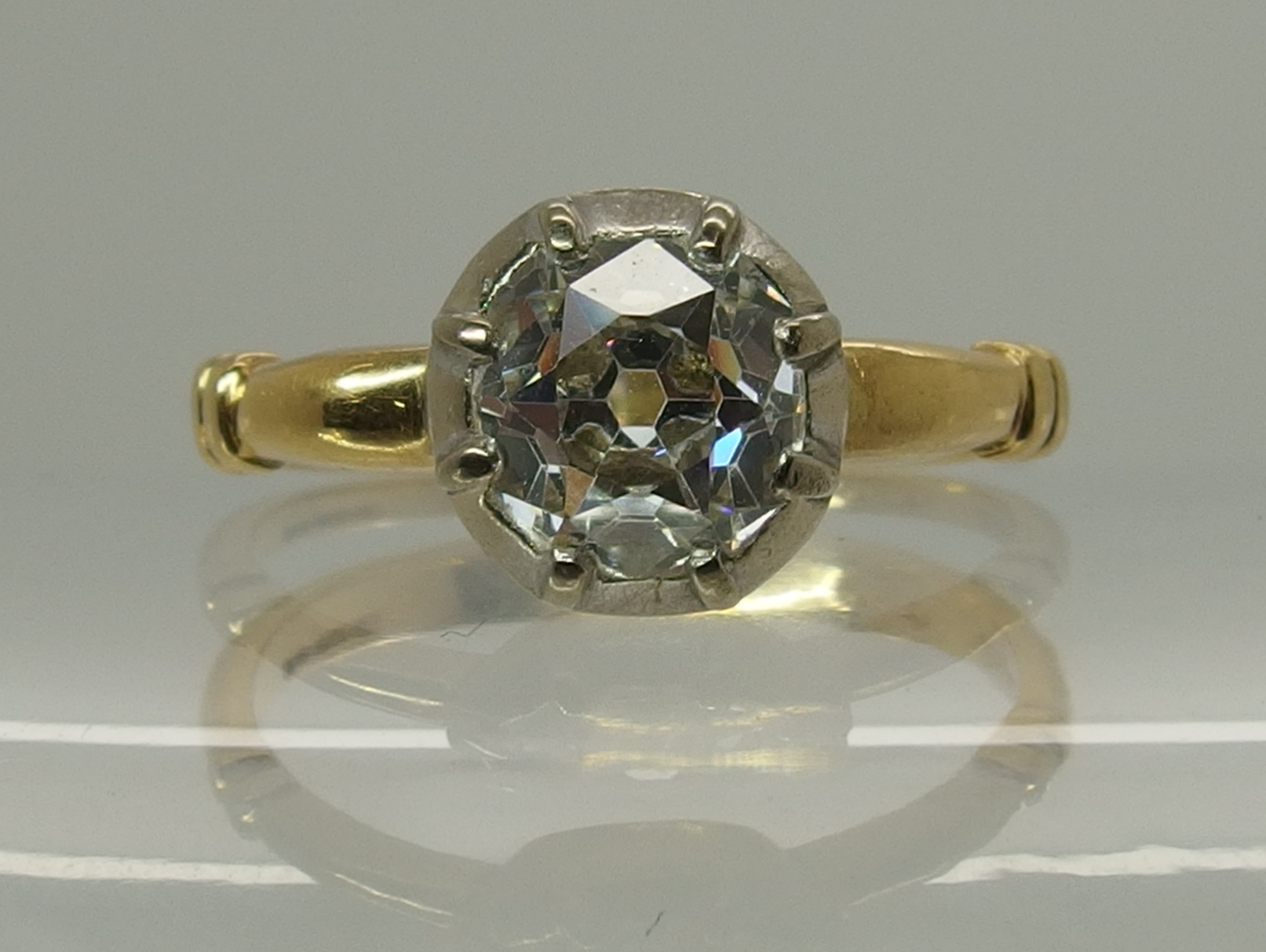 An 18ct gold ring set with an old cut diamond the old cut diamond is estimated approx 1ct, set in