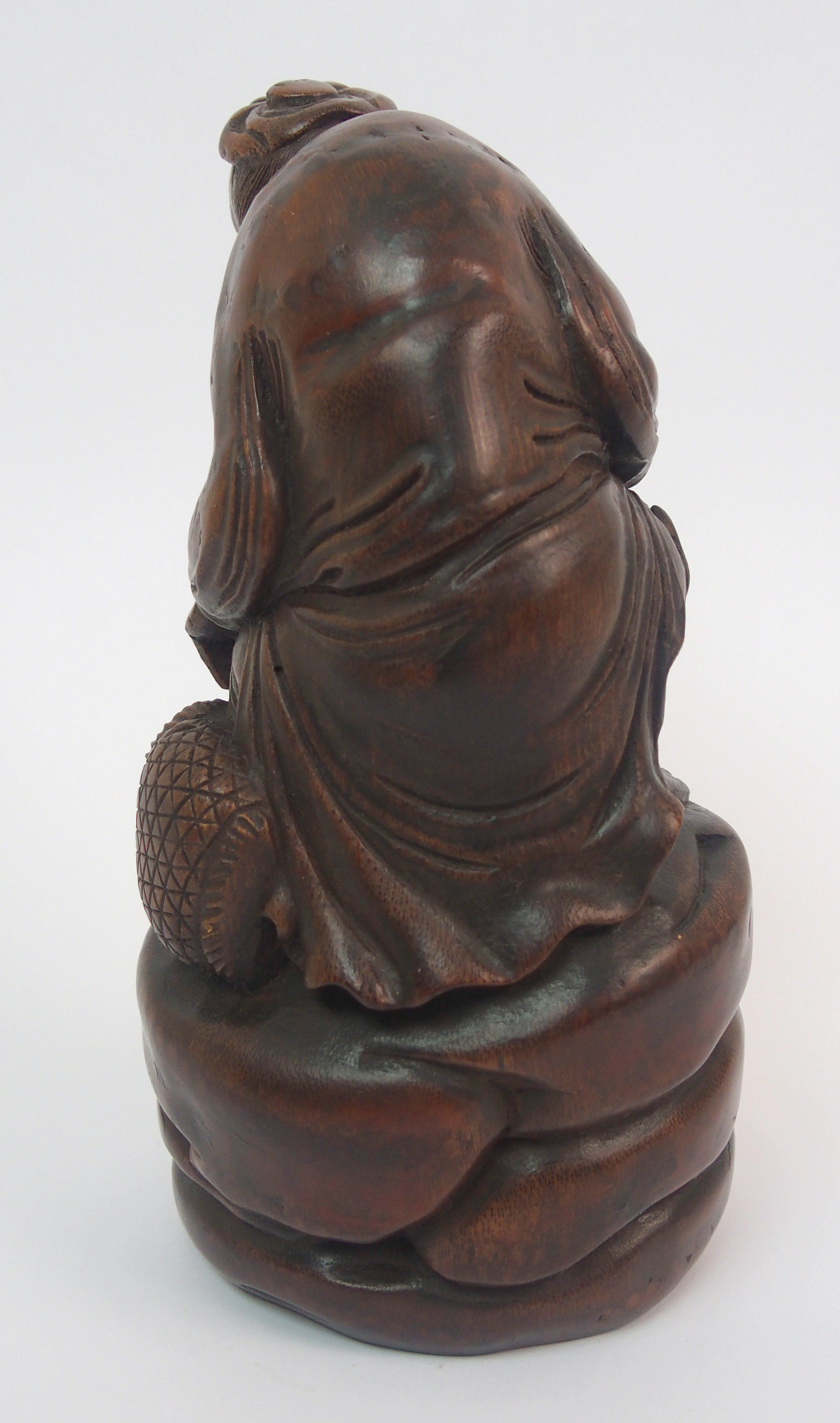 A Chinese bamboo figure of a fisherman seated on a rock above a young boy holding a fish amongst - Image 6 of 10