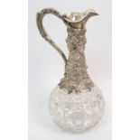 A silver mounted claret jug by Cartwright & Woodword, Birmingham 1860, the cut class body with