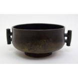 A Chinese bronze two handled censer with angular lug handles, six character mark, 10.5cm diameter