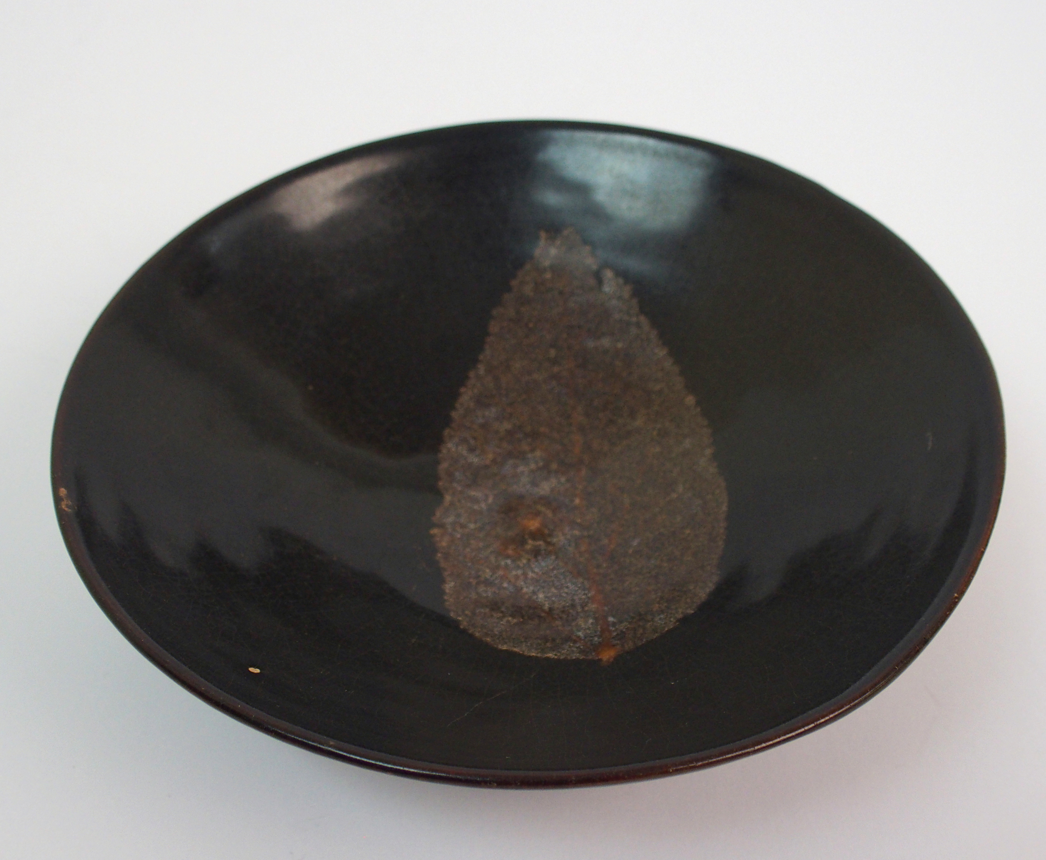 A Chinese black glazed bowl with single leaf decoration, 15.5cm diameter - Image 4 of 10