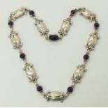 A silver Georg Jensen amethyst necklace pattern number 15 Moonlight blossom, set with cabouchon