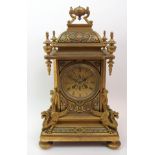 A French gilt metal mantle clock the front, top and sides with enamel decoration, the dial with