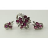An 18ct white gold diamond and red gem stone retro ring and earrings ring head size approx 2cm,