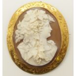 A 9ct gold mounted shell cameo of a maiden with vines the mount engraved with floral swags, size