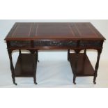 A Victorian mahogany writing desk with triple leather inset skiver above a long and two short