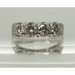 A Chinese gold retro four stone diamond ring the four stones together are estimated approx at 1.