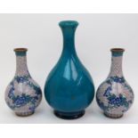 A Chinese turquoise glazed bottle vase 21cm high, and a pair of cloisonne baluster vases decorated