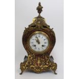 A French tortoiseshell boulle mantle clock the Louis XV-style waisted case with foliate inlay and