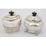 A silver tea caddy rubbed makers marks, Chester 1908, of oval shape with half ribbed body with