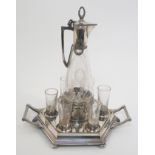 An Art Nouveau WMF EPNS jugendstil liqueur set on hexagonal two-handled tray, comprising mounted