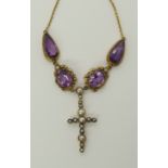 A 15ct amethyst and pearl cross necklace the amethysts are set in filigree and wire work mounts,