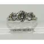An 18ct and platinum three stone diamond ring of estimated approx 1.40cts, in crown mounts to