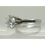 An 18ct white gold diamond solitaire in a high prong setting diamond estimated approx at 1.40cts,