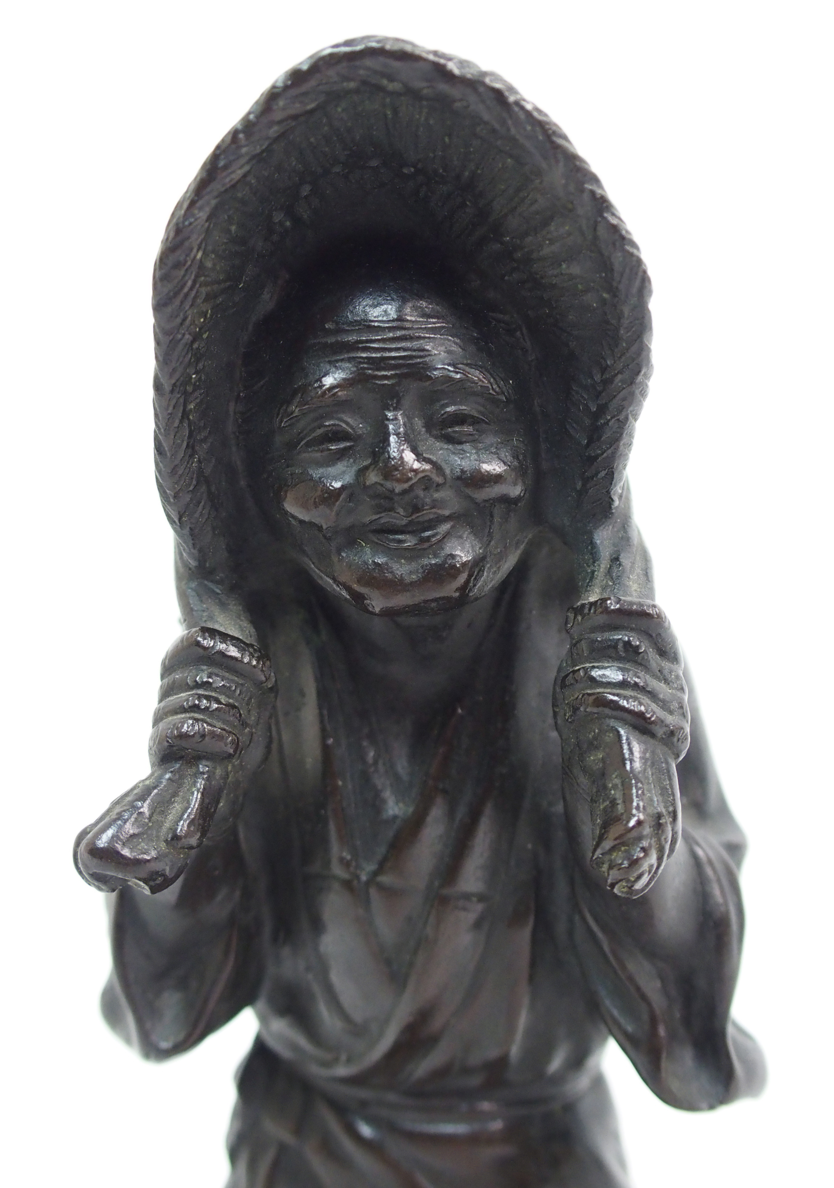 A Japanese bronze figure of a worker standing and holding straw hat around her head and on a mound - Image 3 of 8