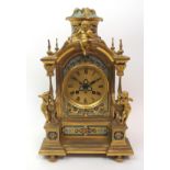 A French gilt metal mantle clock with painted enamel decoration to front, sides and top, the dial