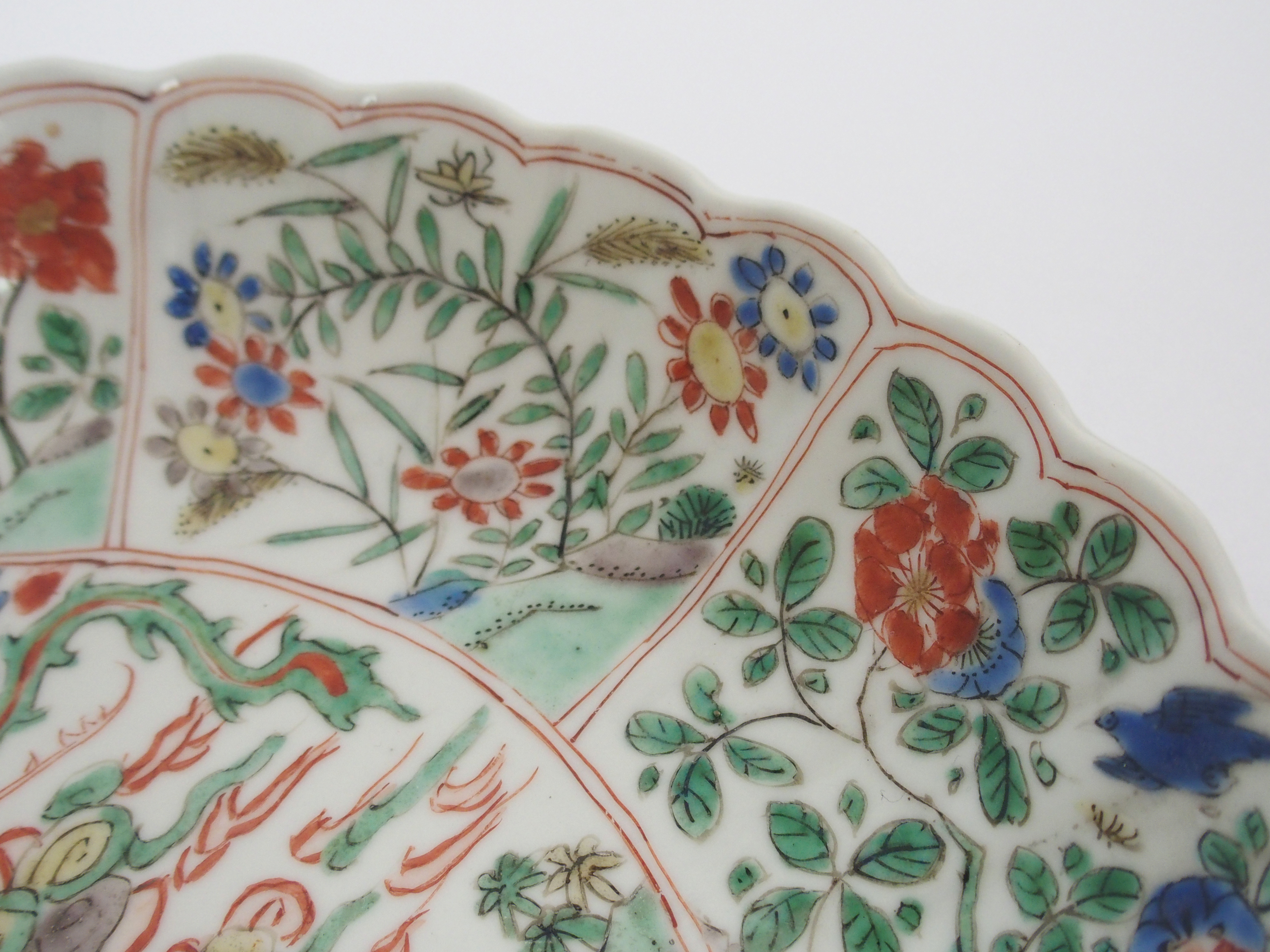 A Chinese lobed dish painted with a kylin and phoenix within panels of birds amongst flowering - Image 6 of 10