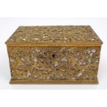 A gilt metal and abalone shell casket with scrolling acanthus decoration, with red velvet
