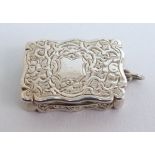 A Victorian silver vinaigrette by Frederick Larson, Birmingham 1868, of rectangular form, the shaped