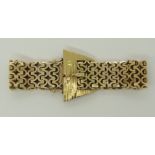 A 9ct yellow fancy link bracelet with a buckle shaped fastening 17.8cm long, width of bracelet 1.