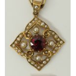 A 15ct gold pendant set with pearls and a garnet on a 15ct gold fancy neck chain, length 47cm,