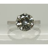 A white metal diamond solitaire ring diamond estimated approx 1.80cts in a crown setting, finger