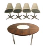 A Merrow Associates circular rosewood table with white melamine lazy Susan in the middle and