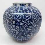 A Chinese octagonal blue and white jar painted with scrolling foliage within stiff leaf bands and
