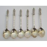 A set of six silver coffee spoons by J A Restall & Co., Birmingham 1927, the finials modelled as