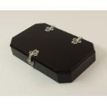 An Art Deco onyx, diamond and ruby box in the manner of CARTIER, both the lid and the box are carved