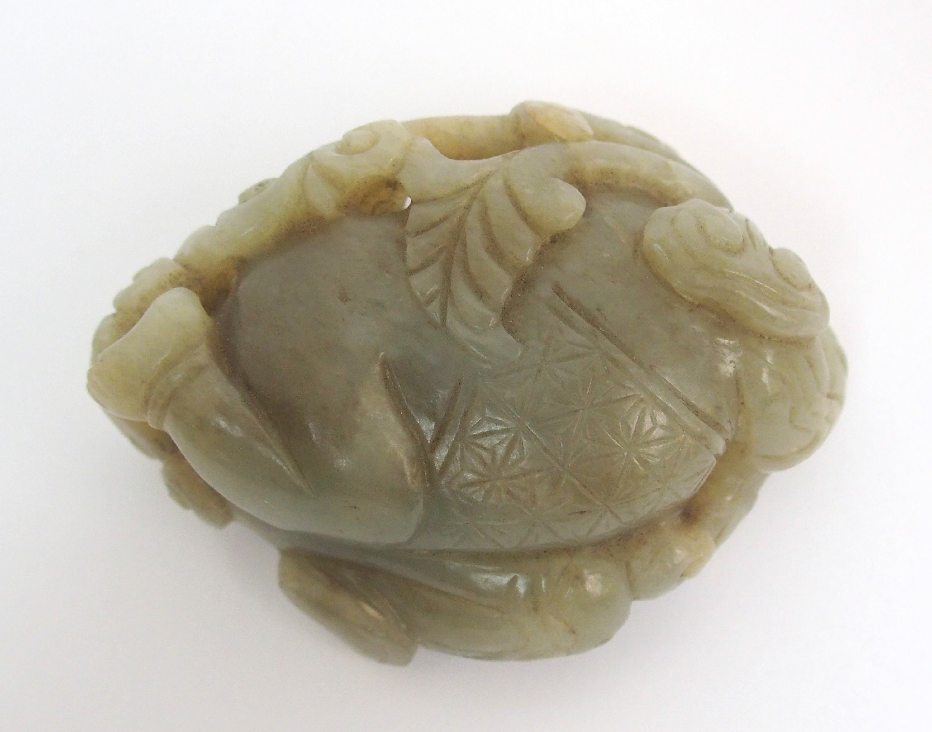 A Chinese jade carving of a child lying and holding lingzhi frond, 7cm wide - Image 7 of 10