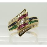 An 18ct diamond, ruby sapphire and emerald dress ring channel set in rows, finger size O, weight 6.