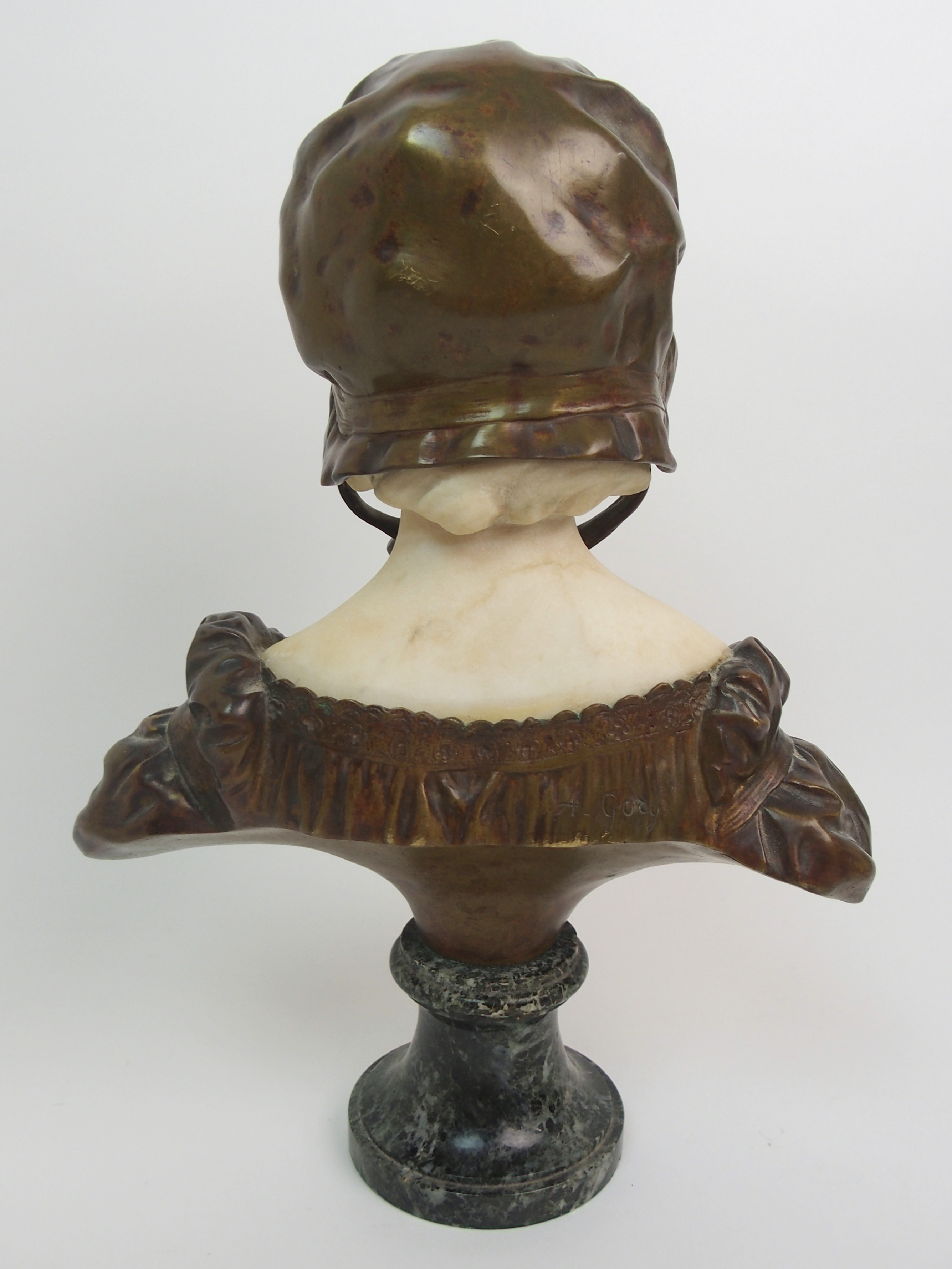 Affortunato Gory (active 1895-1925) Bronze and alabaster bust of a girl modelled wearing a bonnet, - Image 7 of 10