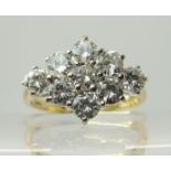 An 18ct gold diamond cluster ring the nine diamonds have an estimated approx total of 1.70cts,