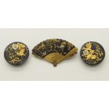 A shakudo fan shaped brooch and two shirt studs all three decorated with cranes and quails among